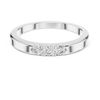 Band ring with a minimalist trio of small diamonds set on top.