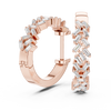 Rose gold hoop earrings adorned with baguette-cut clear gemstones arranged in a zigzag pattern