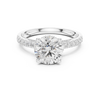 solitaire diamond ring with pav‚ diamond band.