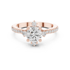 Round center diamond ring with six-prong setting and pav‚ band