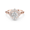 round center diamond ring with floral-inspired halo of round and baguette diamonds
