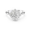 round center diamond ring with floral-inspired halo of round and baguette diamonds