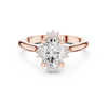 Oval cut diamond ring with a sleek band and sparkling side accents.