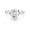 Oval cut diamond ring with a sleek band and sparkling side accents.