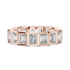 A bold eternity band featuring rectangular emerald-cut diamonds
