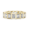 A bold eternity band featuring rectangular emerald-cut diamonds