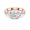 Three-stone diamond ring with pav‚-accented band.