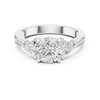 Three-stone diamond ring with pav‚-accented band.