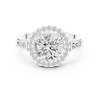 Round cut diamond halo ring with tapered baguette side stones.