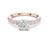 Engagement ring with a brilliant round solitaire center stone and graduated side diamonds.