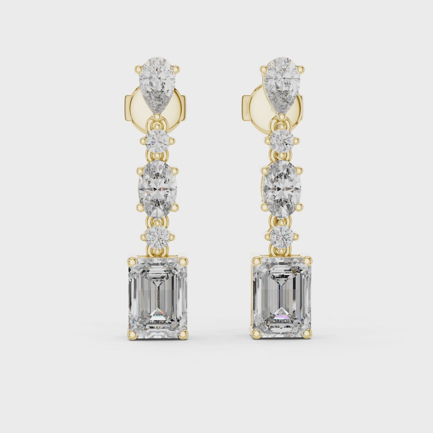 Elegant drop earrings featuring multiple diamond cuts set in rose gold.