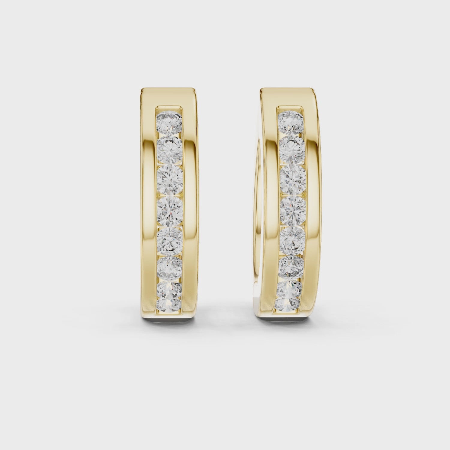 Elegant rose gold hoop earrings adorned with a row of sparkling round-cut diamonds