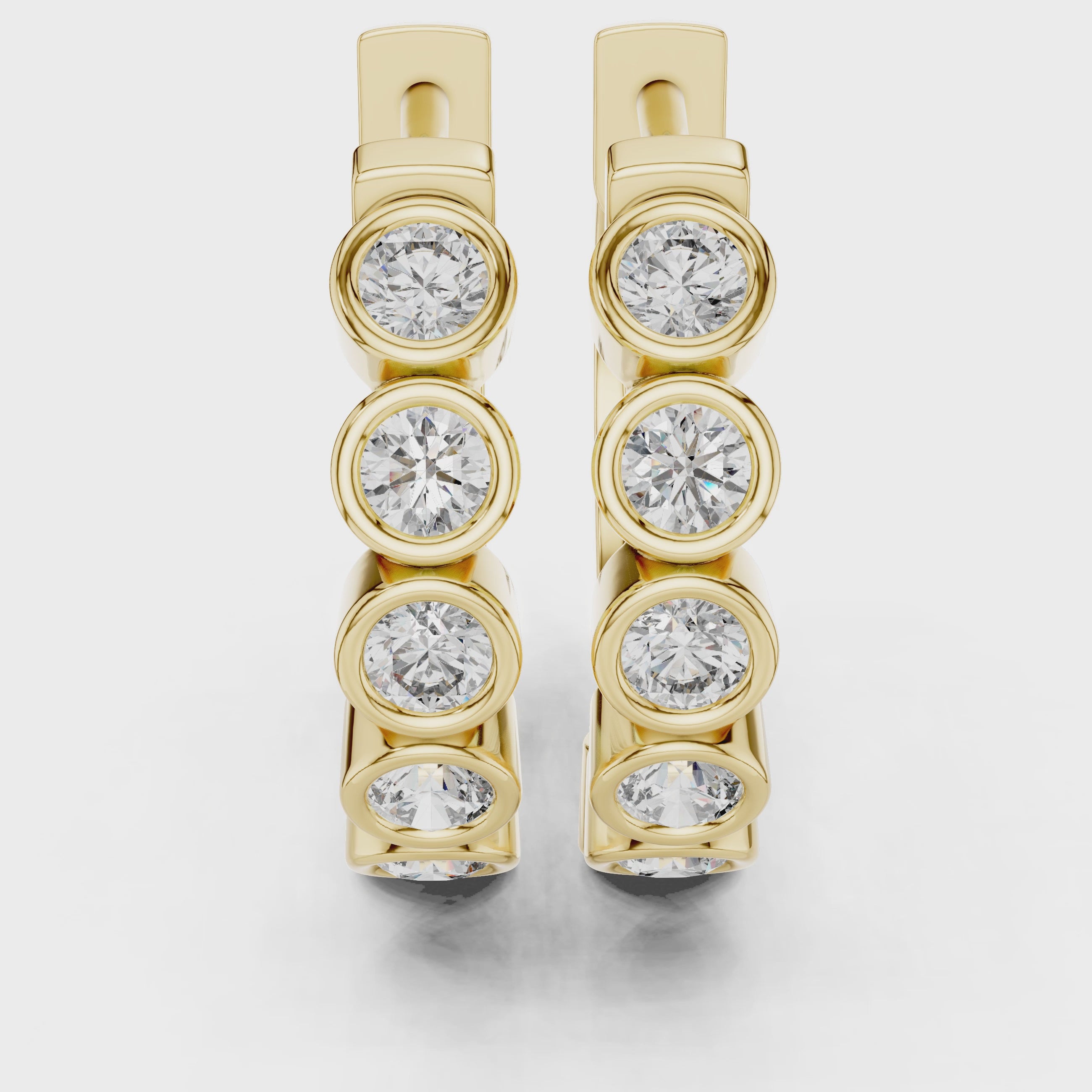 Rose gold hoop earrings with bezel-set round diamonds
