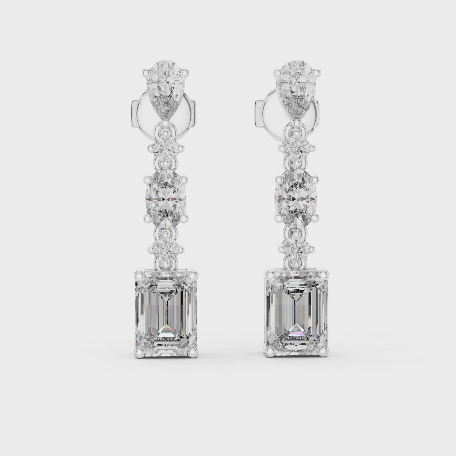 Elegant drop earrings featuring multiple diamond cuts set in rose gold.