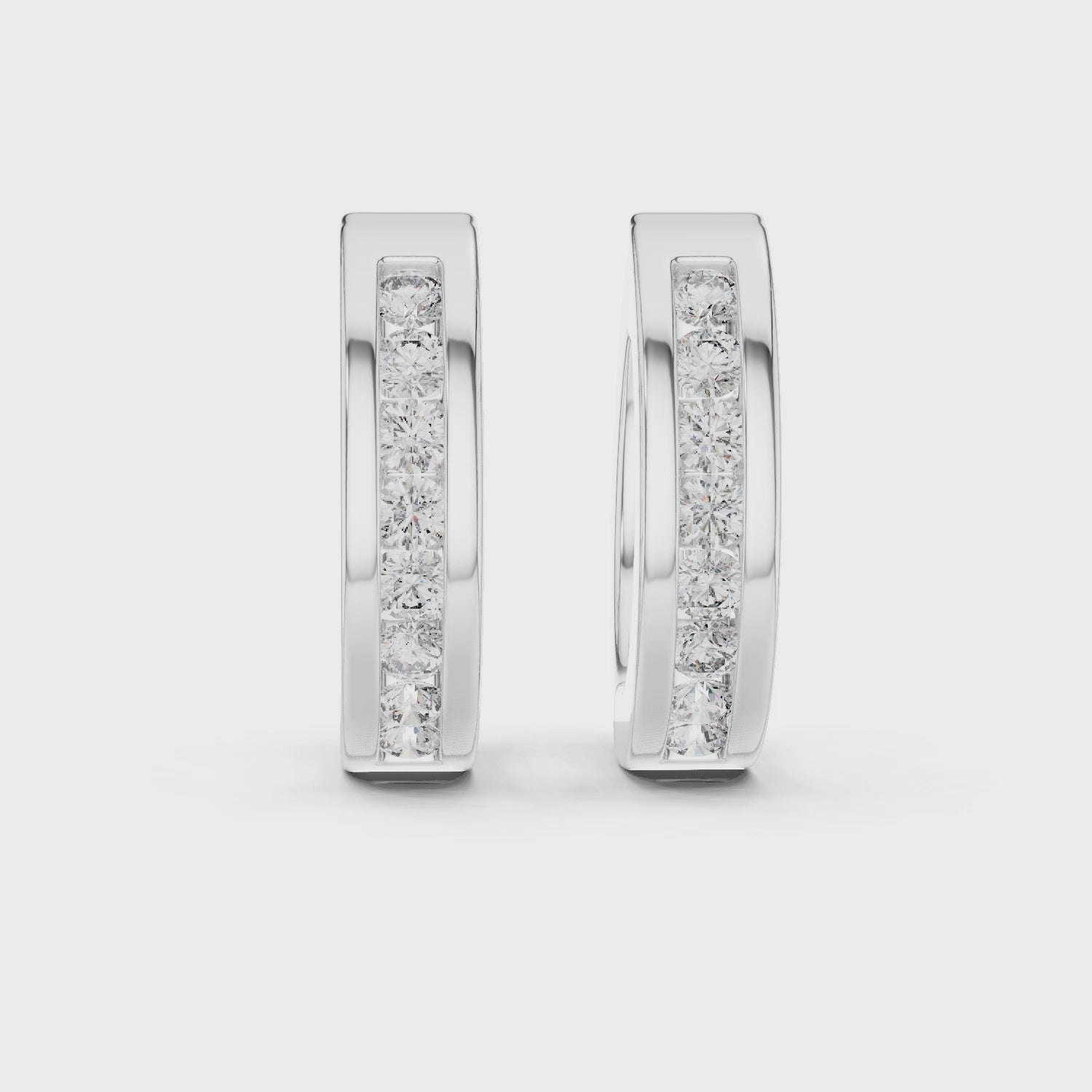 Elegant rose gold hoop earrings adorned with a row of sparkling round-cut diamonds