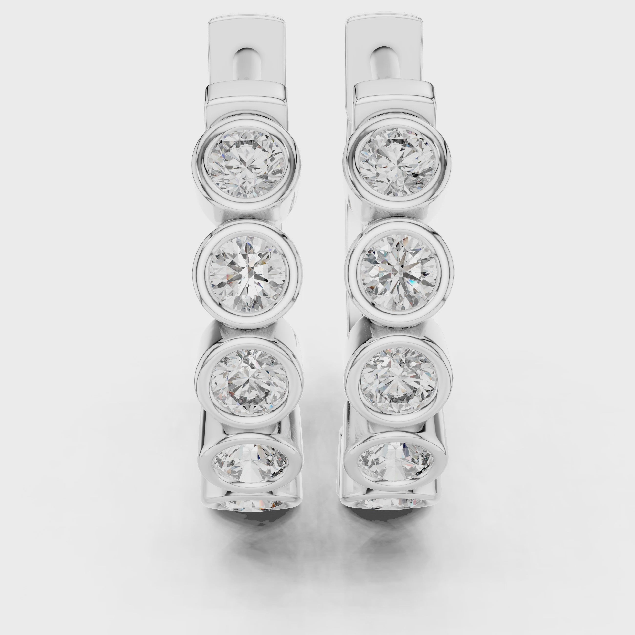 Rose gold hoop earrings with bezel-set round diamonds